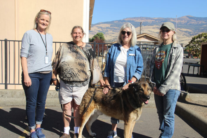 Cass Sinclair (OHRA executive director), unidentified OHRA guest, Nancy Lyon (Street Dogs), Jo Cooper (Street Dogs), and of course “Rebel” the dog take a break during the construction of a dog enclosure at the OHRA Center. 